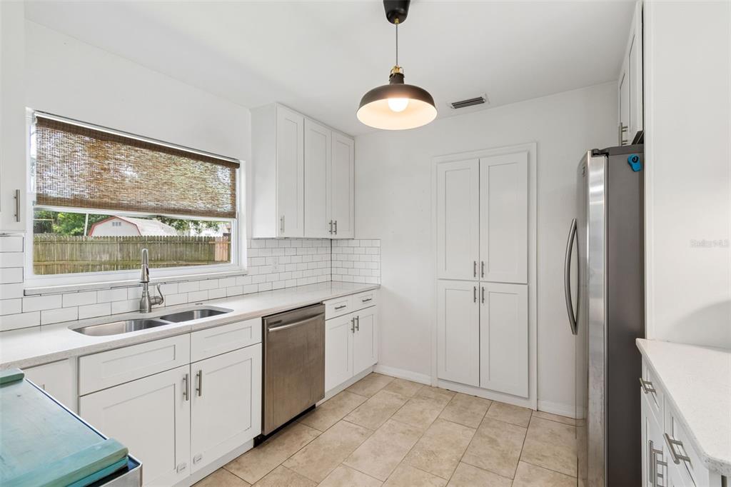 8043 124th Street North Seminole, FL 33772 - Photo 24 of 68 a kitchen with a sink and cabinets