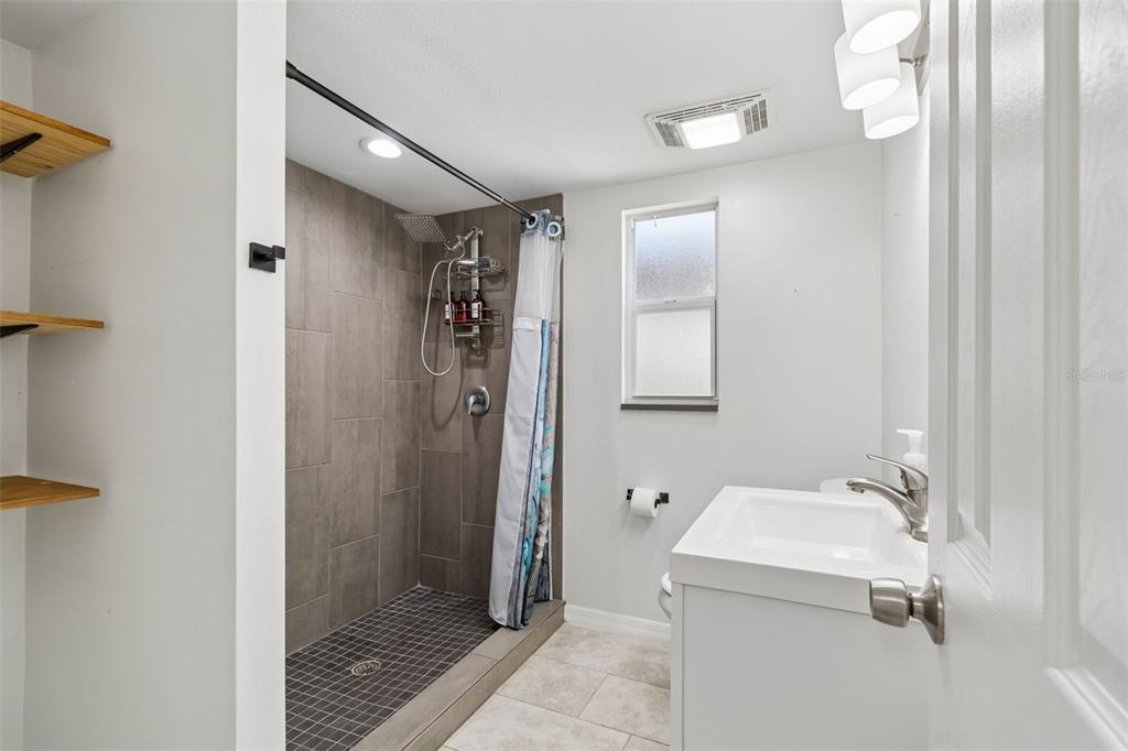 8043 124th Street North Seminole, FL 33772 - Photo 30 of 68 a bathroom with a sink and shower