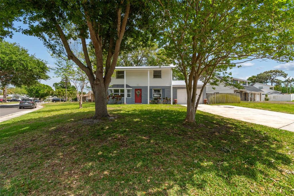 8043 124th Street North Seminole, FL 33772 - Photo 3 of 68 a view of a house with a yard