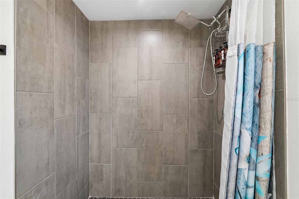 8043 124th Street North Seminole, FL 33772 - Photo 33 of 68 a bathroom with a shower