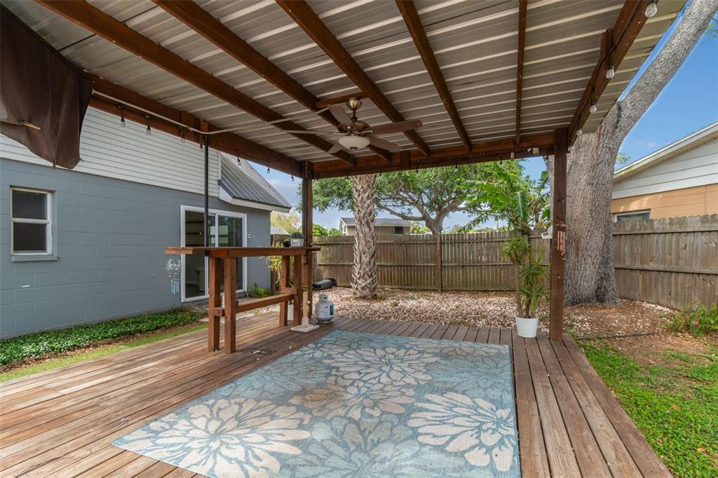 8043 124th Street North Seminole, FL 33772 - Photo 59 of 68 a view of a backyard with wooden floor