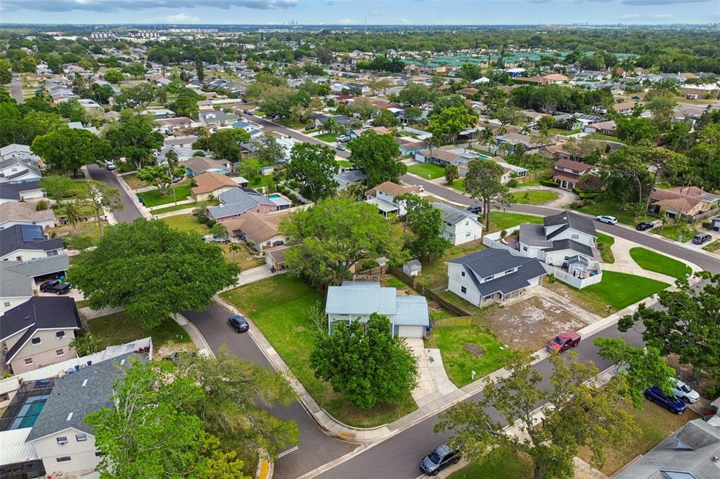 8043 124th Street North Seminole, FL 33772 - Photo 66 of 68 an aerial view of residential houses with outdoor space