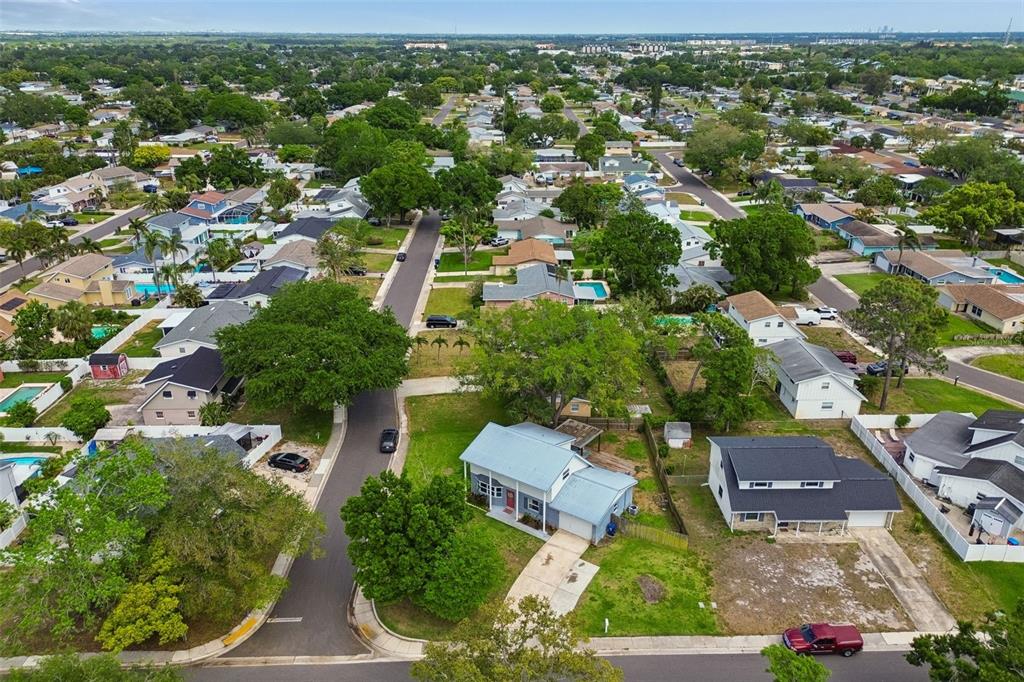 8043 124th Street North Seminole, FL 33772 - Photo 67 of 68 an aerial view of residential houses with outdoor space and trees