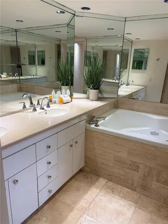 a view of a hallway with wooden shelves