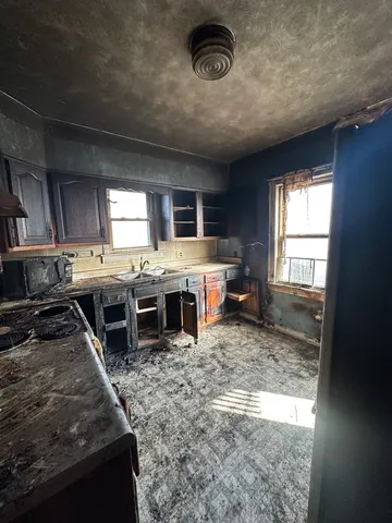 a kitchen with a stove and a refrigerator
