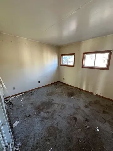 an empty room with windows