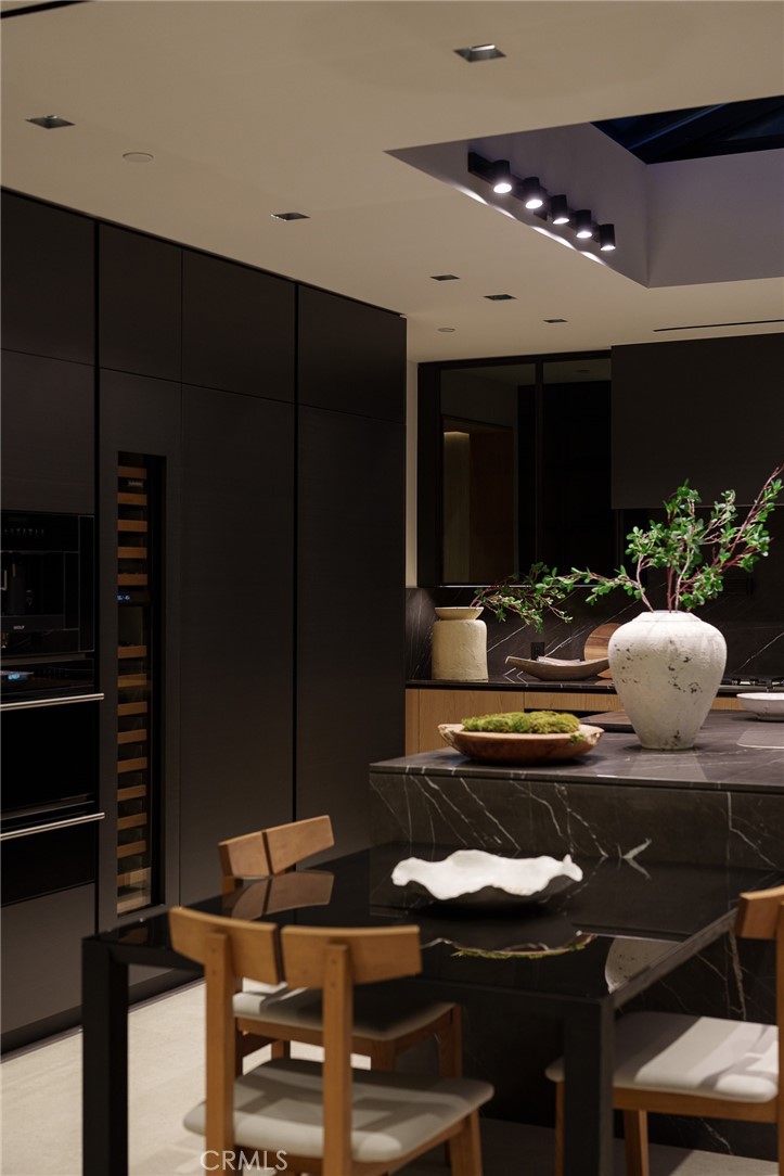 3187 Oakdell Road Studio City, CA 91604 - Photo 31 of 63 a kitchen with a table and chairs in it