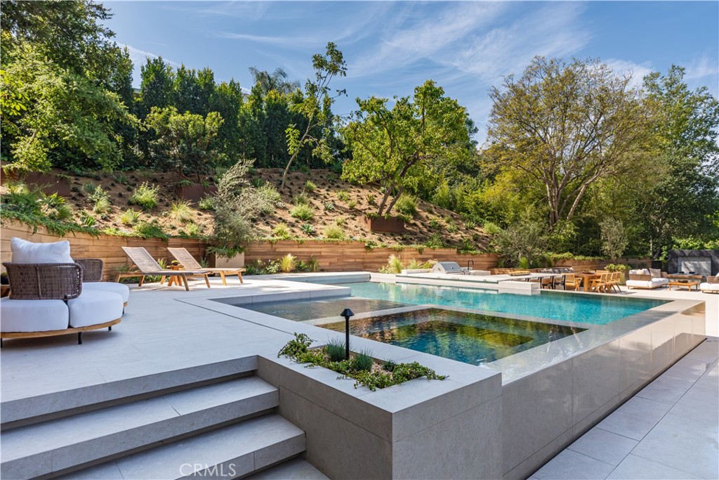 3187 Oakdell Road Studio City, CA 91604 - Photo 57 of 63 a view of a swimming pool with a patio