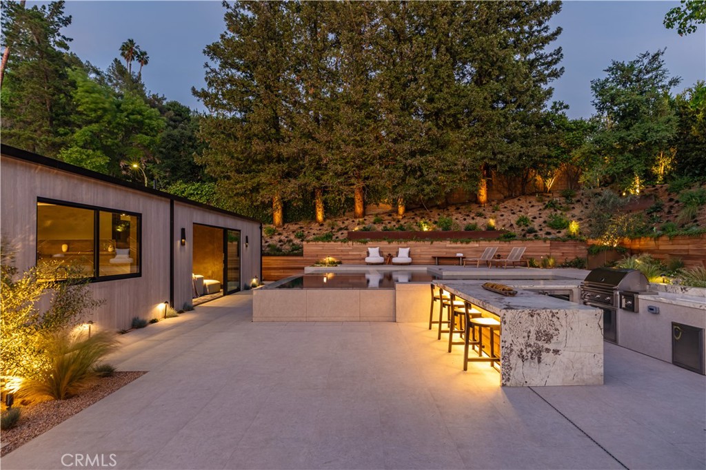 3187 Oakdell Road Studio City, CA 91604 - Photo 59 of 63 a view of a swimming pool with a patio