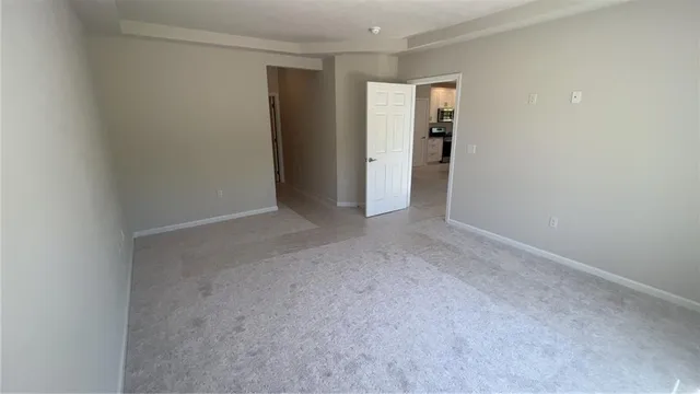 a view of a hallway to rooms