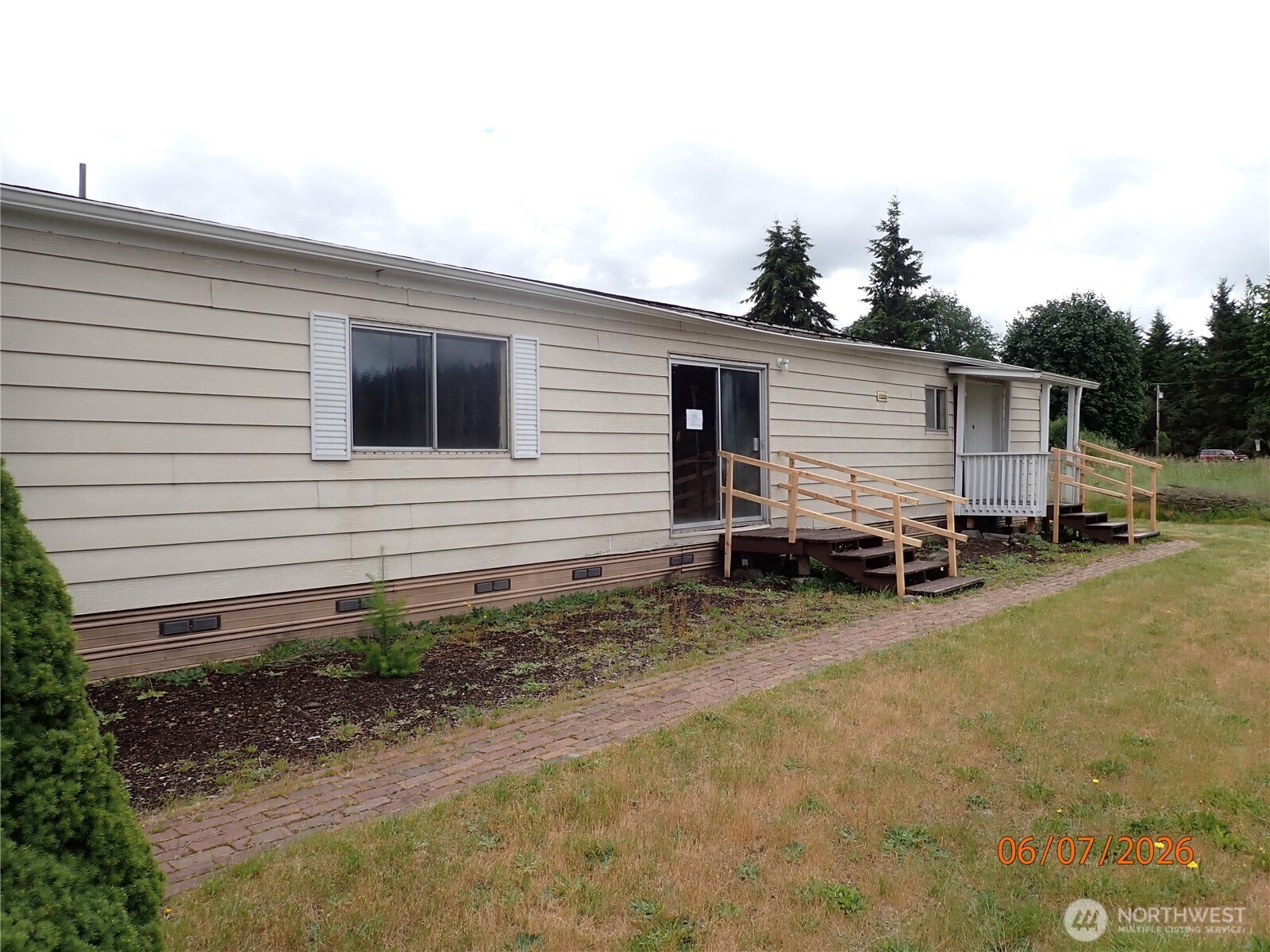 9217 183rd Avenue Southwest Rochester, WA 98579 - Photo 2 of 26 a view of a house with backyard