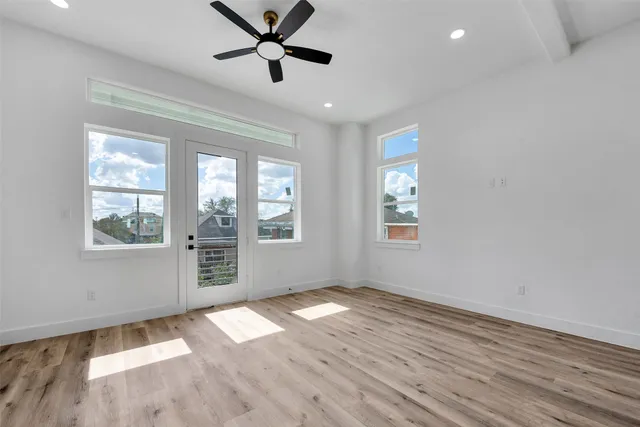 a view of a kitchen with a sink cabinets and wooden floor