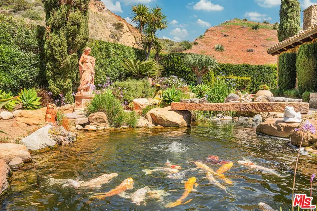 a view of swimming pool with a garden
