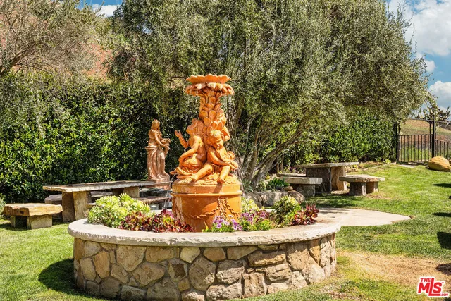 a view of a couches chair and fire pit in the patio