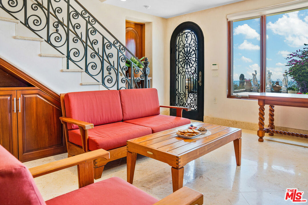 4440 Encinal Canyon Road, Unit GH Malibu, CA 90265 - Photo 4 of 16 a living room with furniture and a window