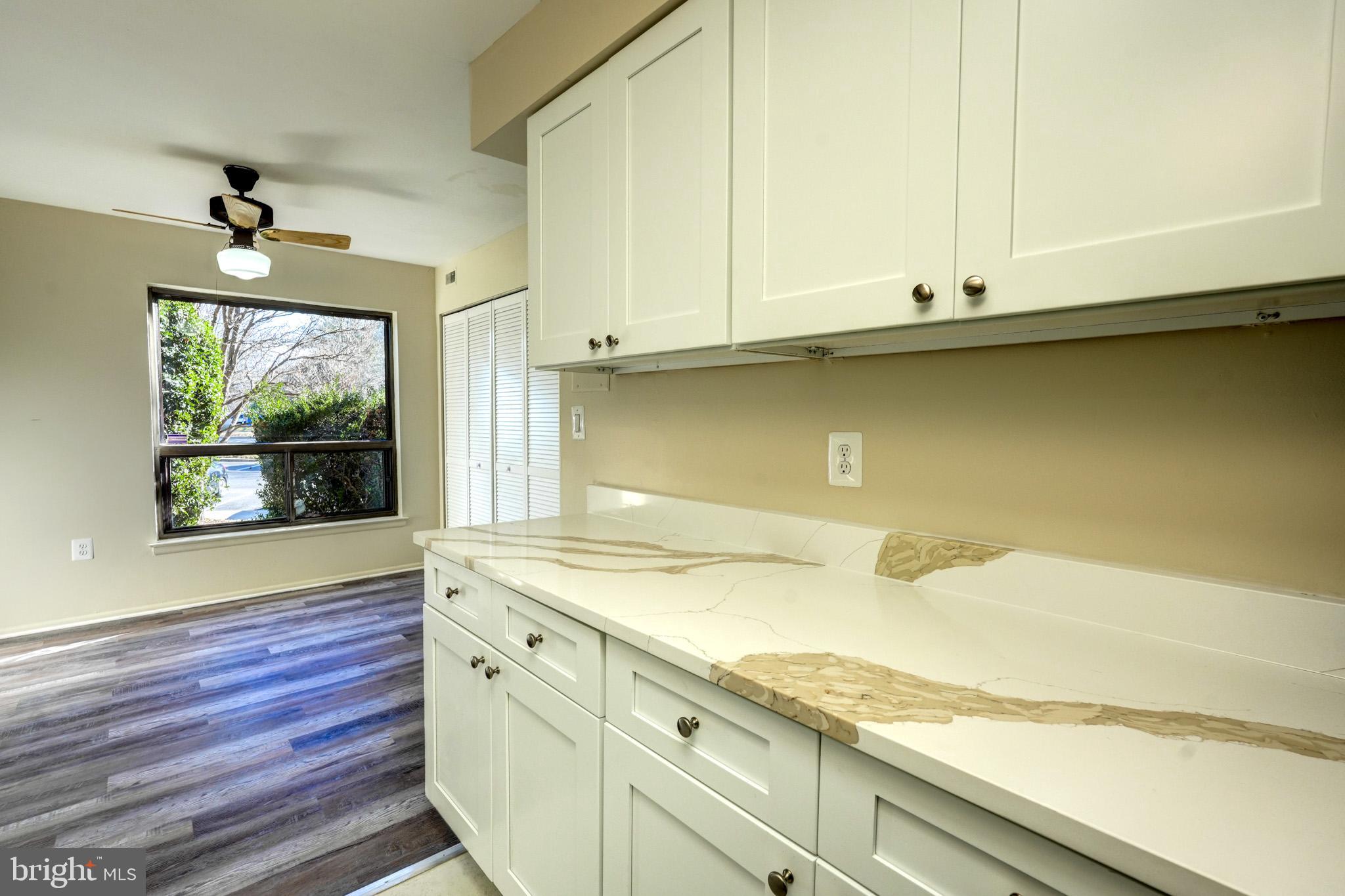 415 Christopher Avenue, Unit 11 Gaithersburg, MD 20879 - Photo 13 of 36 a bathroom with a sink and a mirror