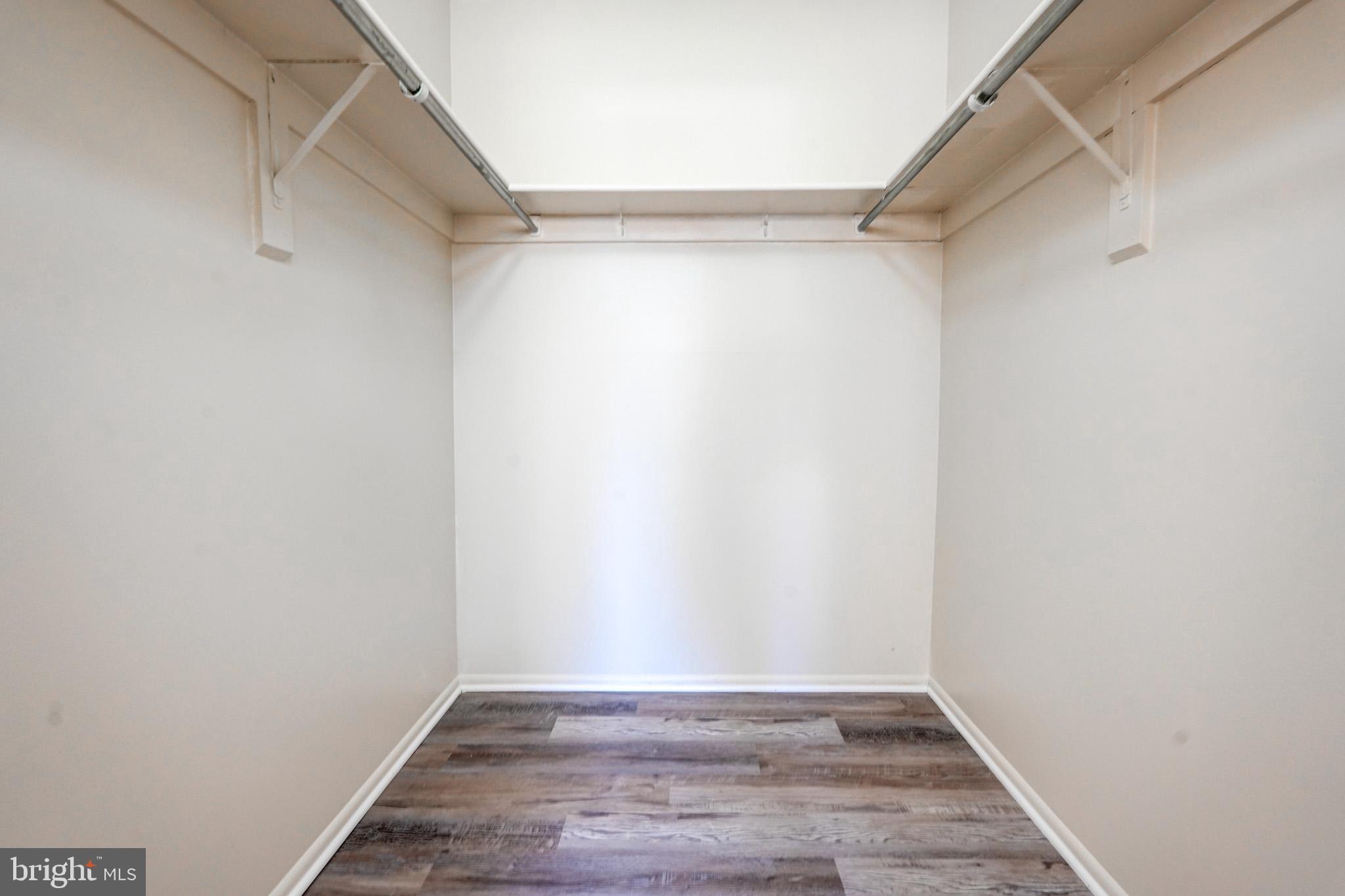 415 Christopher Avenue, Unit 11 Gaithersburg, MD 20879 - Photo 29 of 36 a view of an empty walk in closet