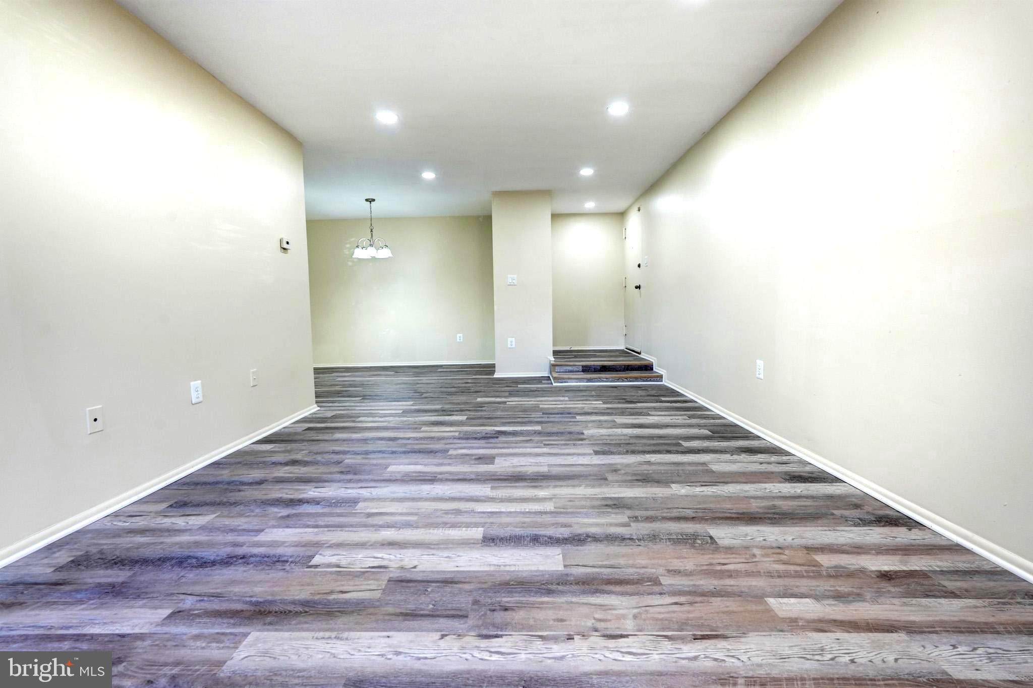 415 Christopher Avenue, Unit 11 Gaithersburg, MD 20879 - Photo 3 of 36 a view of an empty room