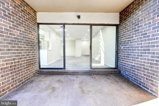 a view of a door and chair in the patio