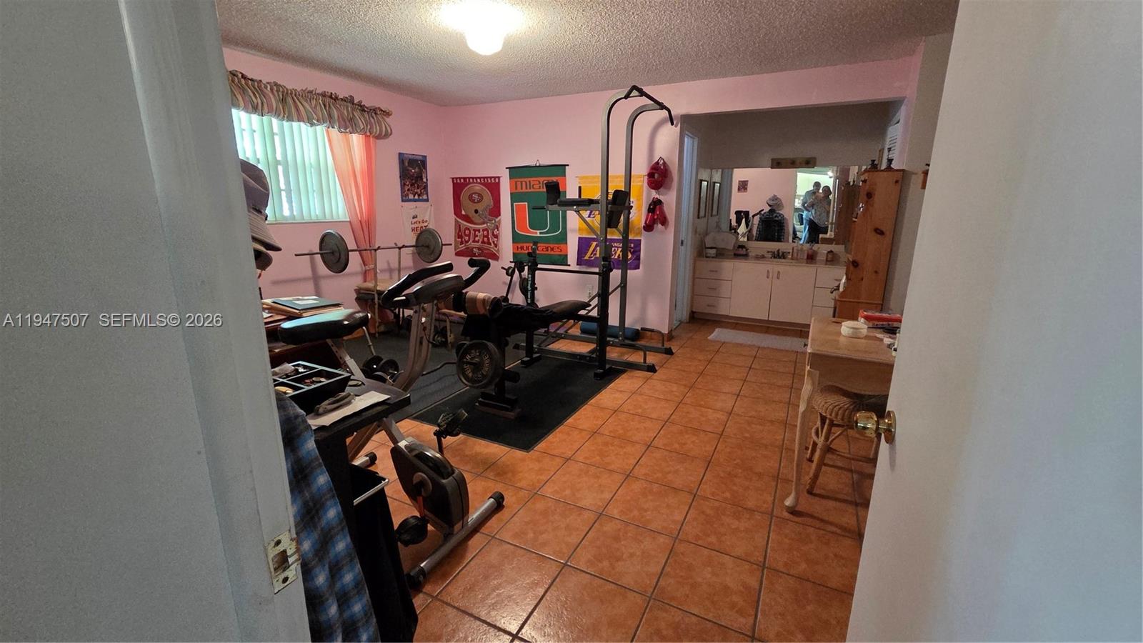 11933 Southwest 196th Terrace Miami, FL 33177 - Photo 14 of 29 a view of a room with gym equipment