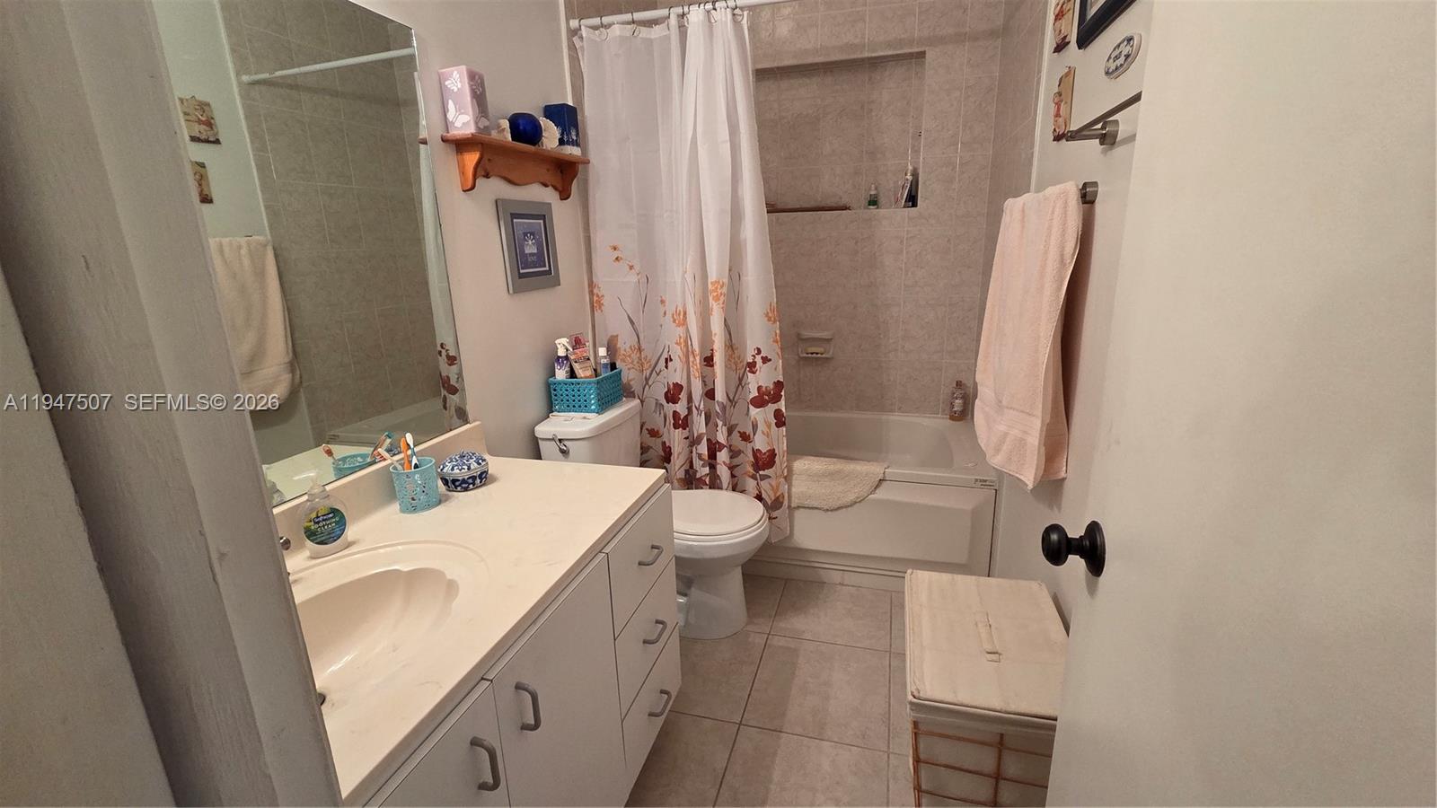 11933 Southwest 196th Terrace Miami, FL 33177 - Photo 18 of 29 a bathroom with a sink a toilet and shower