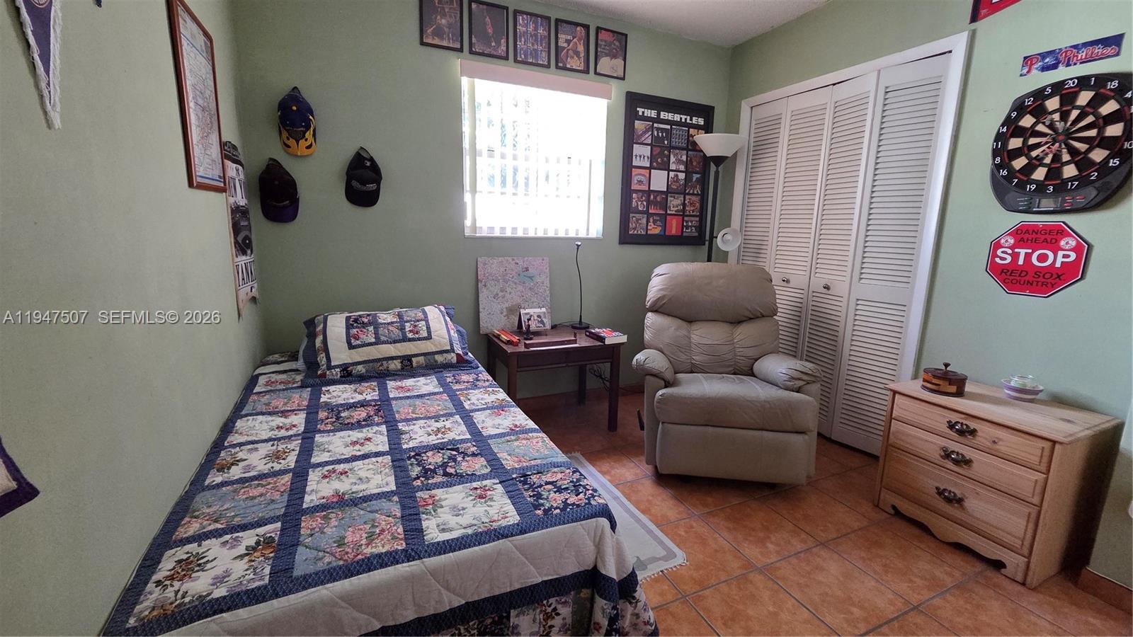11933 Southwest 196th Terrace Miami, FL 33177 - Photo 20 of 29 a bedroom with furniture and a window
