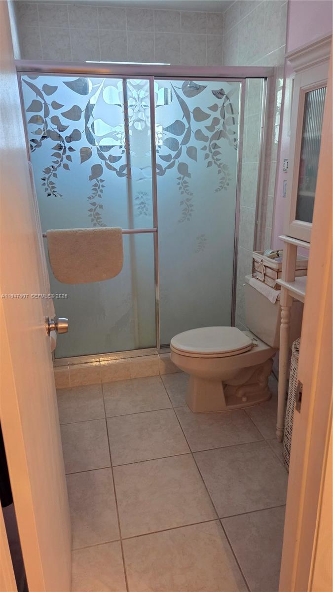 11933 Southwest 196th Terrace Miami, FL 33177 - Photo 21 of 29 a bathroom with a toilet and a shower