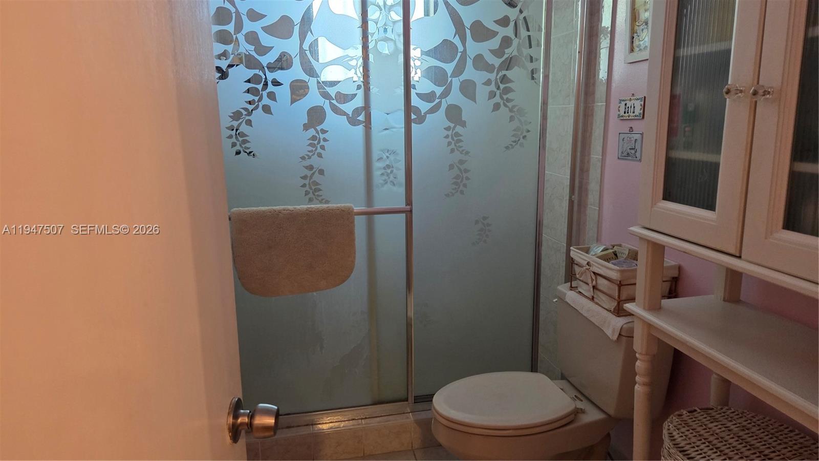 11933 Southwest 196th Terrace Miami, FL 33177 - Photo 22 of 29 a bathroom with a sink a toilet and shower