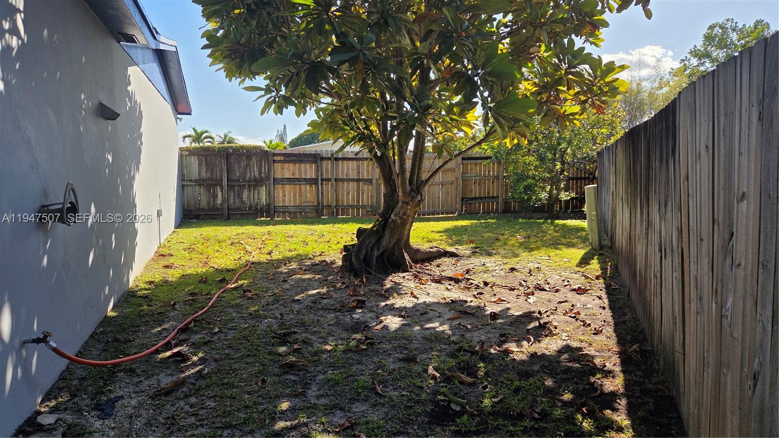 11933 Southwest 196th Terrace Miami, FL 33177 - Photo 23 of 29 a view of a yard with large trees