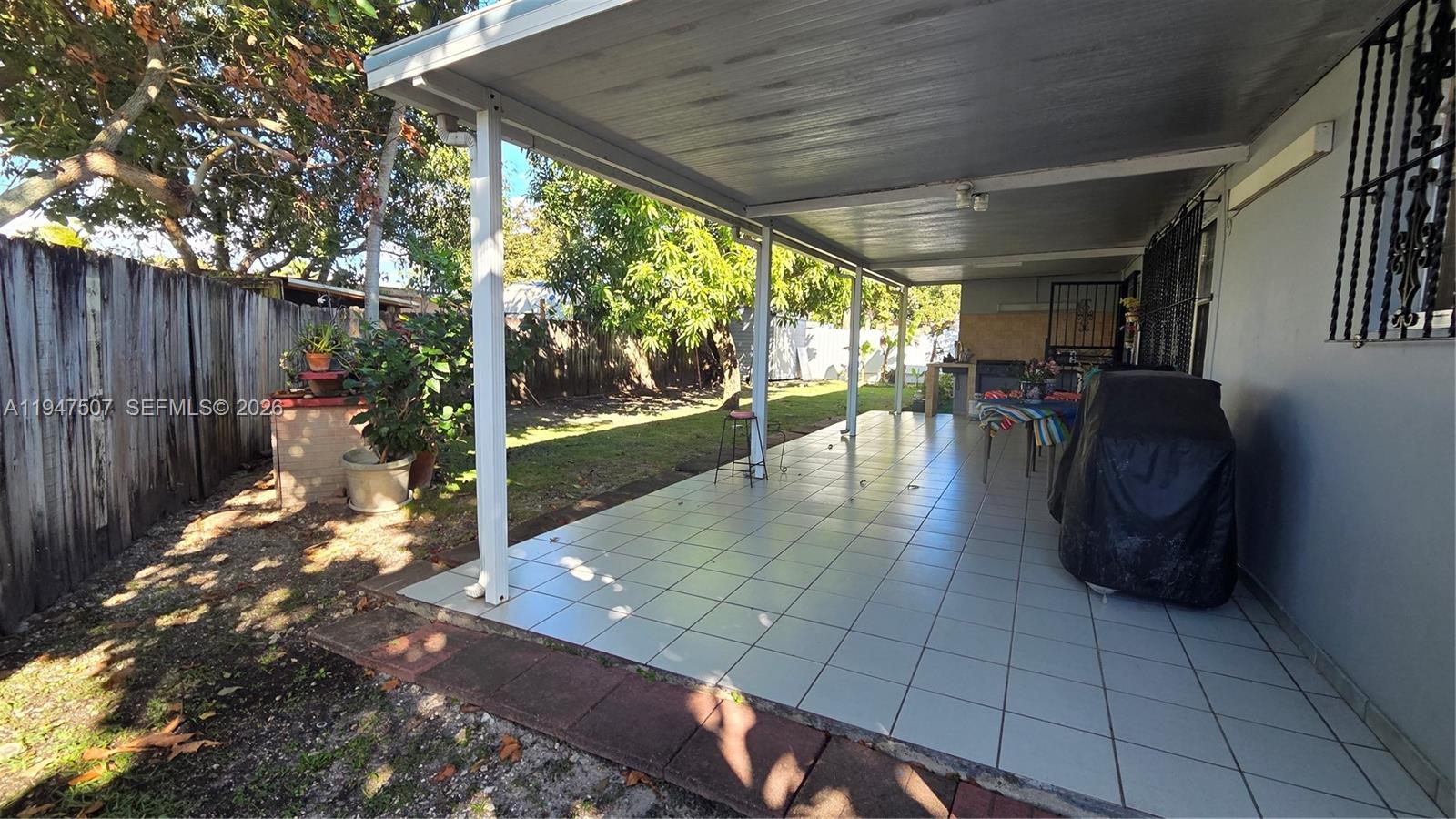 11933 Southwest 196th Terrace Miami, FL 33177 - Photo 25 of 29 a view of a porch with furniture