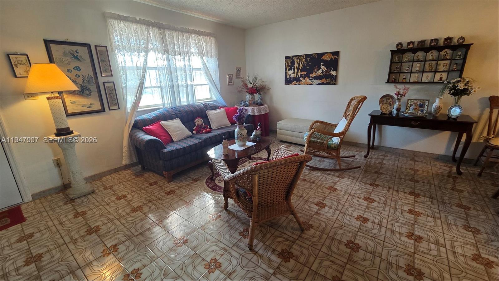 11933 Southwest 196th Terrace Miami, FL 33177 - Photo 7 of 29 a living room with furniture a window and a flat screen tv