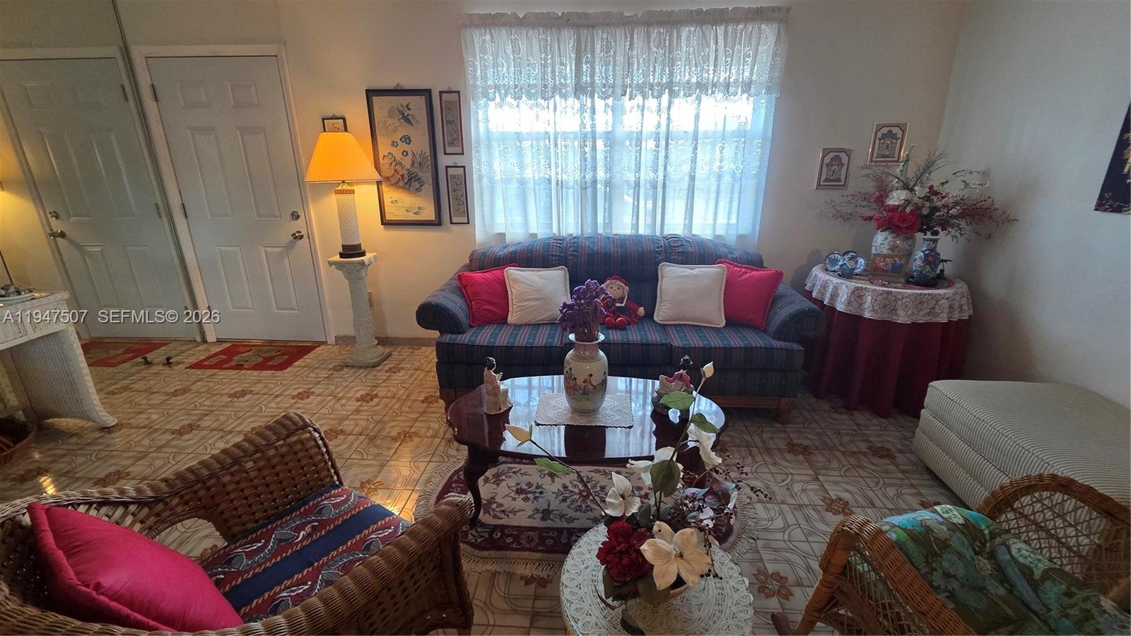 11933 Southwest 196th Terrace Miami, FL 33177 - Photo 8 of 29 a living room with furniture and a window