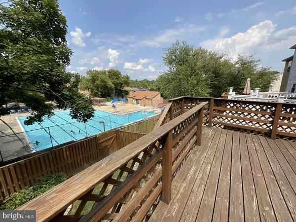 a balcony with view of trees in the background