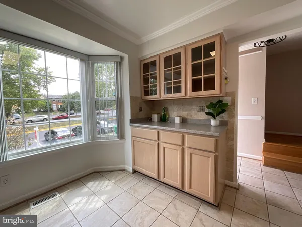 a kitchen with stainless steel appliances granite countertop a refrigerator stove a sink and a microwave