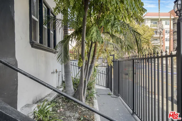 a front view of a house with tree s