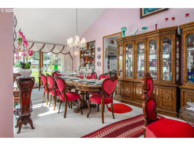 a view of a dining room with furniture and chandelier