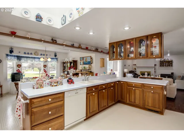 a kitchen with a sink cabinets and window