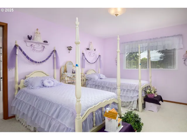 a bedroom with furniture and a potted plant