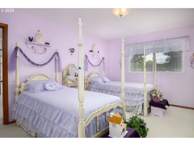 a bedroom with furniture and a potted plant