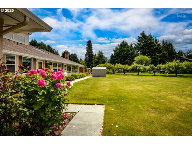 a view of a swimming pool with an outdoor space and seating area