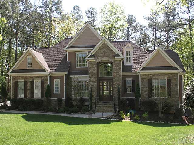 6828 Mactavish Way Raleigh, NC 27613 - Photo 1 of 25 a front view of a house with a yard