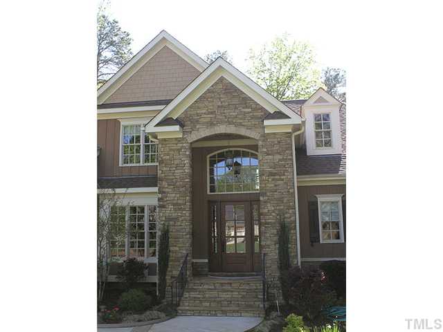 6828 Mactavish Way Raleigh, NC 27613 - Photo 2 of 25 a front view of a house with a yard