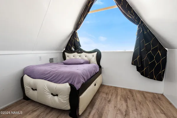 a view of livingroom with furniture and wooden floor