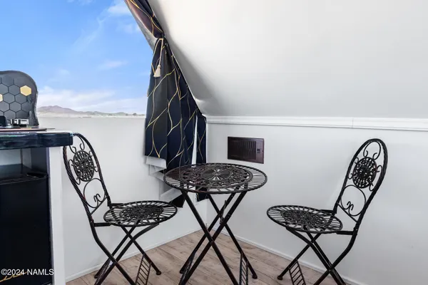 a view of a roof with sitting area