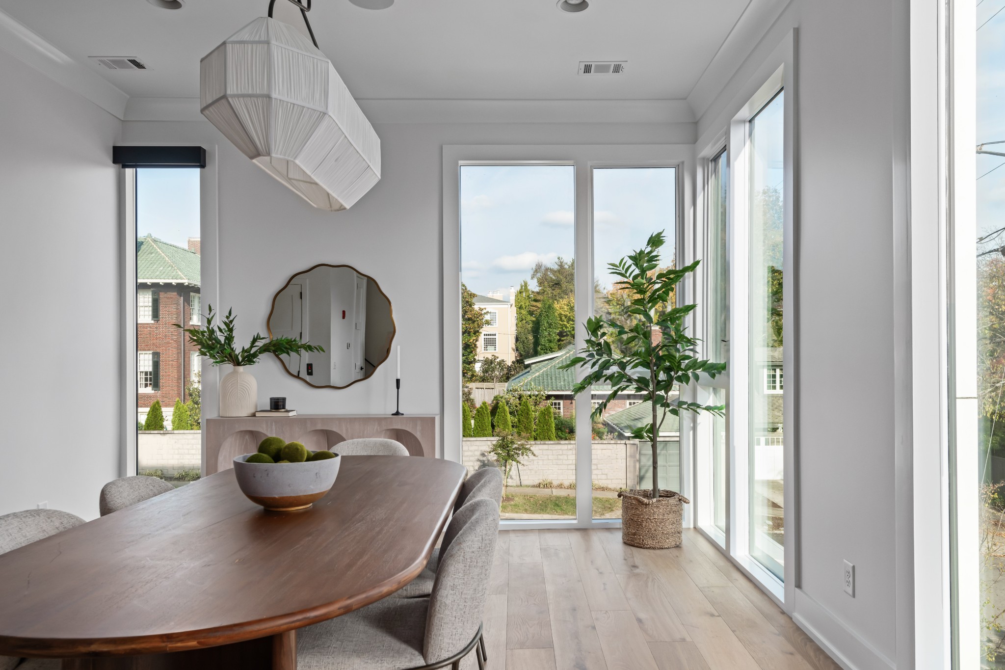 95 Leonard Avenue, Unit 8 Nashville, TN 37205 - Photo 16 of 36 a living room with furniture a potted plant and a chandelier