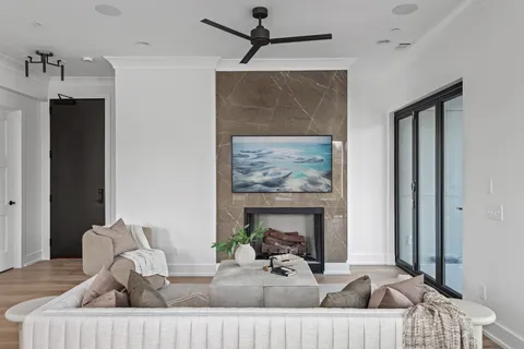 a view of a livingroom with furniture and a fireplace