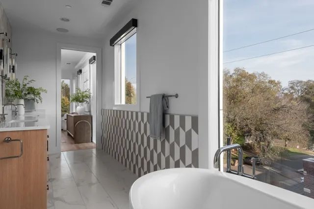 a bathroom with a bathtub and a sink