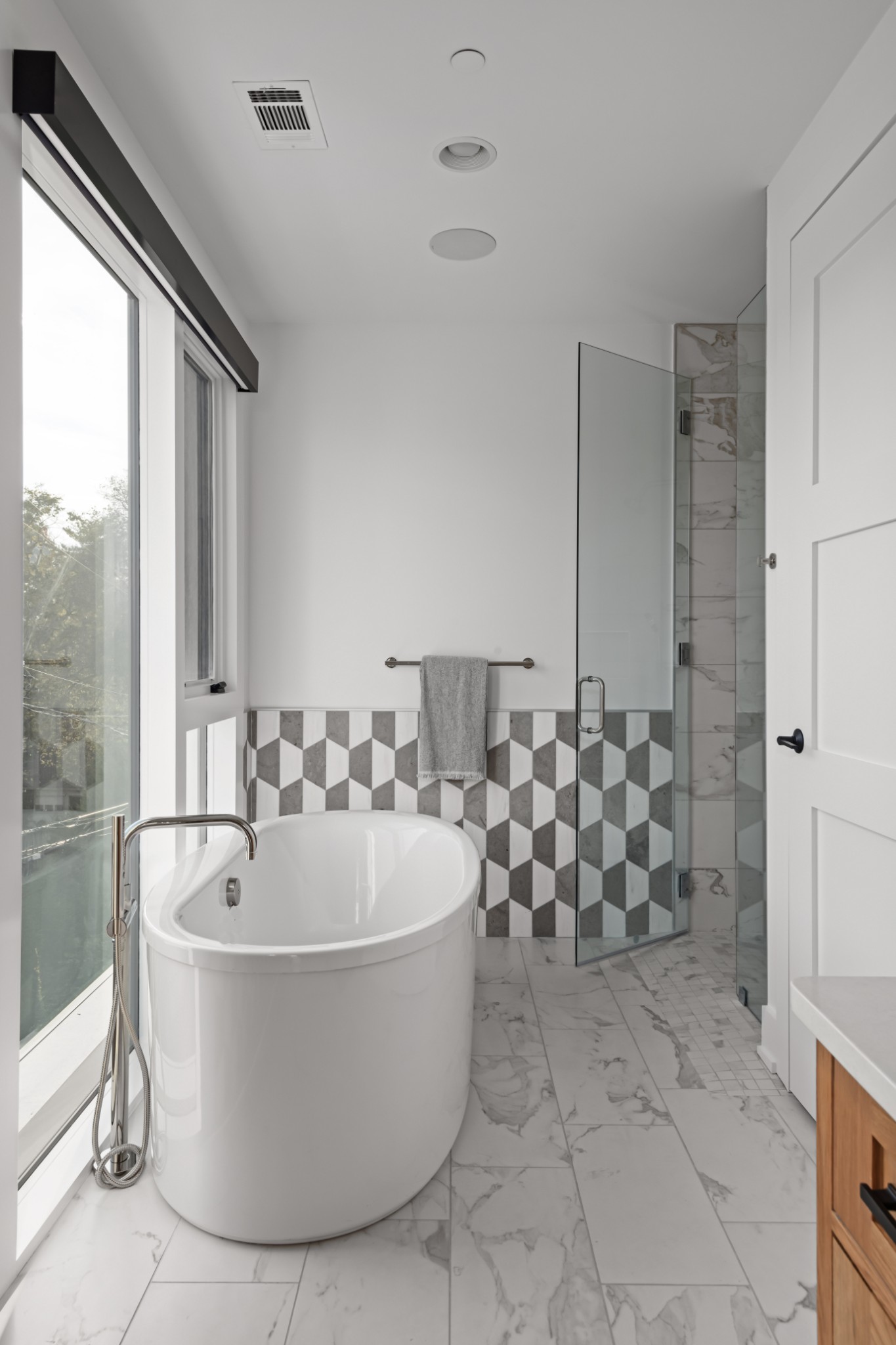 95 Leonard Avenue, Unit 8 Nashville, TN 37205 - Photo 28 of 36 a white bath tub sitting in a bathroom next to a window