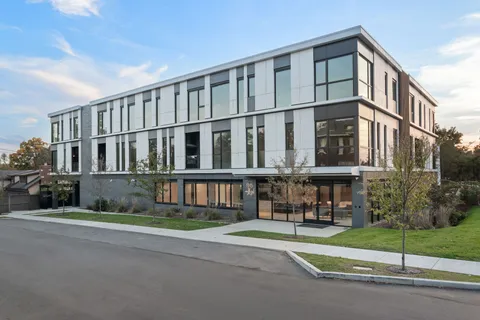 a view of a building with a street