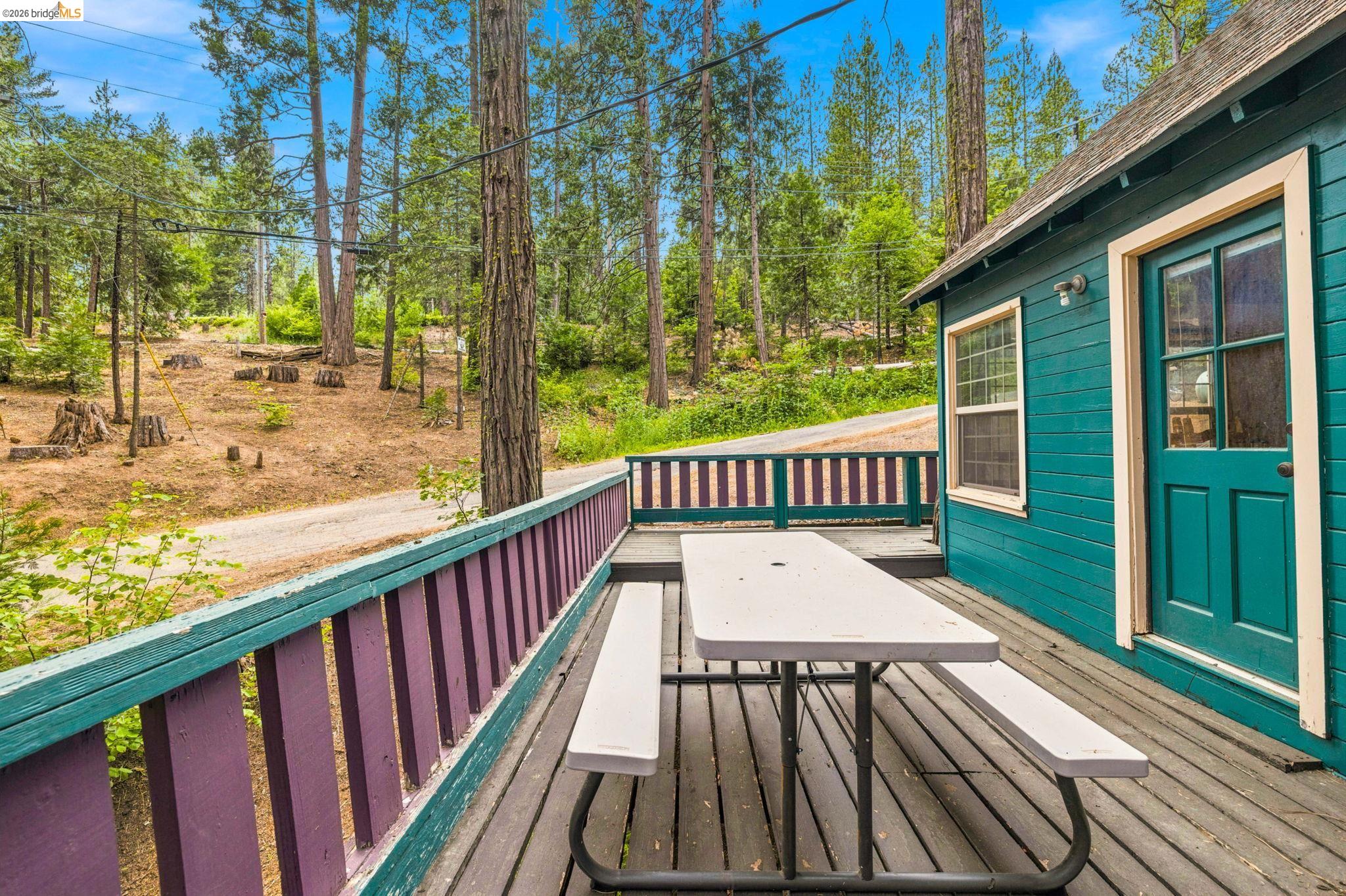 25822 Long Barn Sugar Pine Road Long Barn, CA 95335 - Photo 26 of 28 a view of balcony with wooden floor and outdoor seating